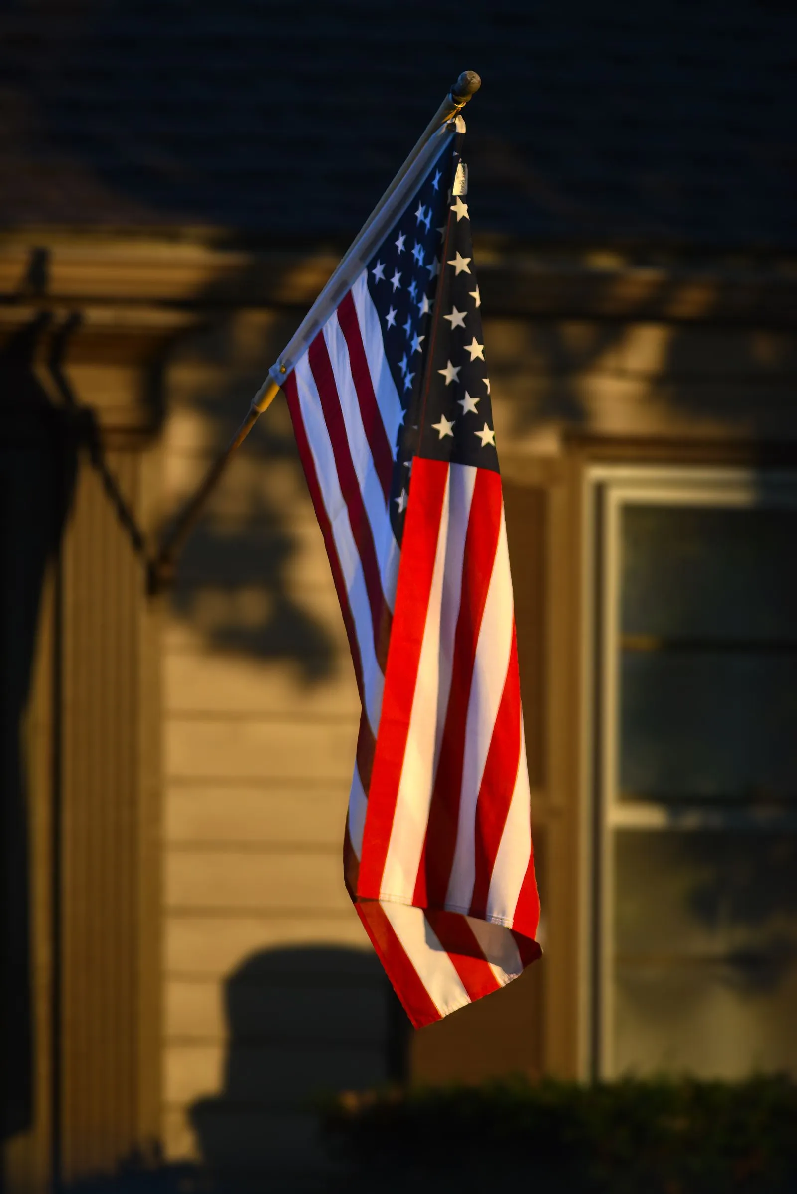 A home lit in red, white and blue for the Fourth of July